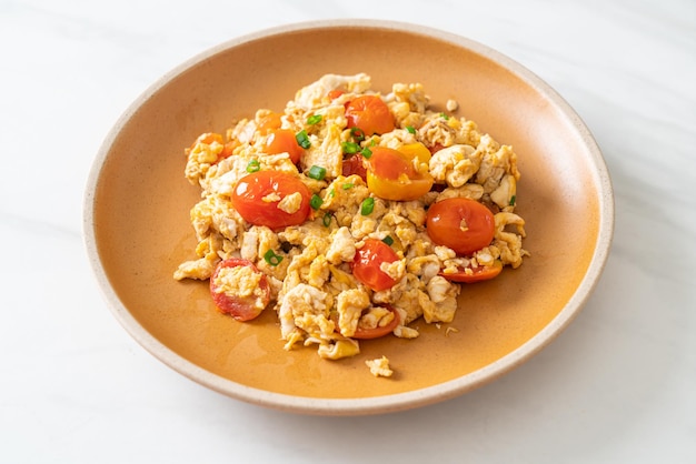 Stirfried tomatoes with egg on plate