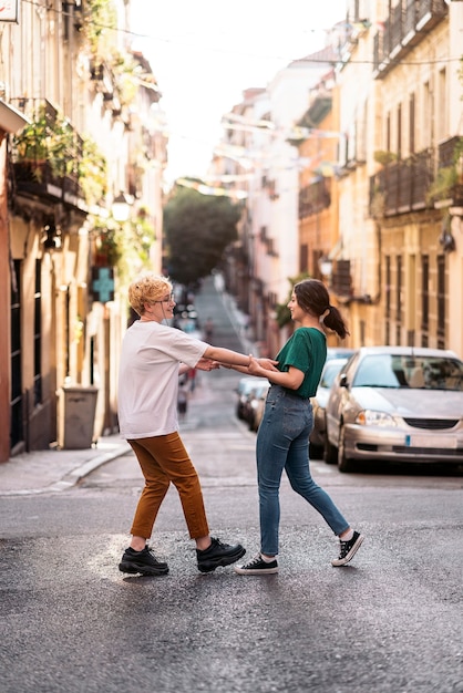 Stock photo of Lesbian couple loving. They are hugging. They are on a date. Urban concept.