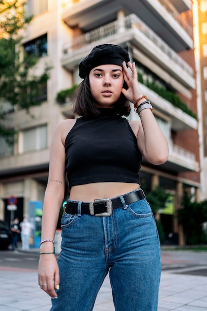 Stock photo of a young woman posing and looking at camera.