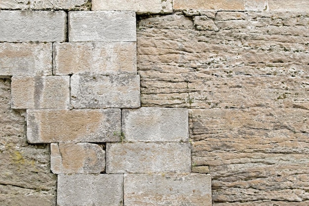 Stone brick texture with cracks closeup