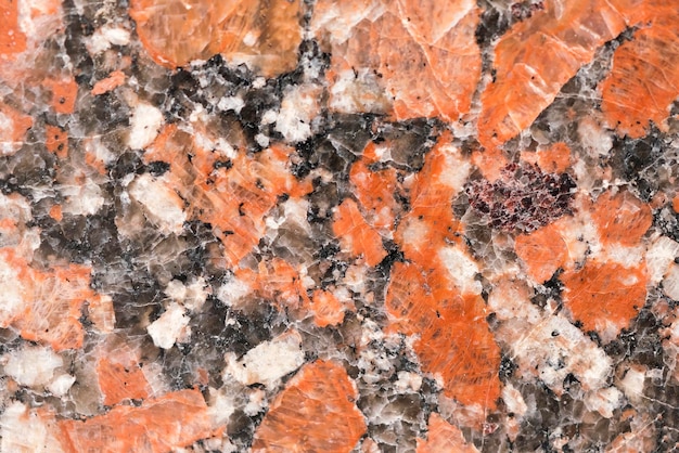 Stone granite with black white and red spots texture background