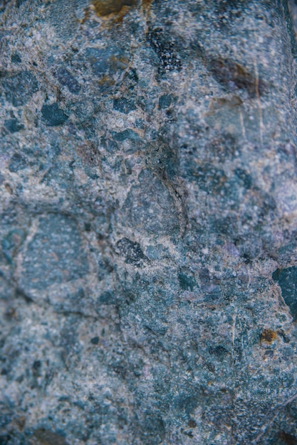 Stone grayblue textured background Natural stone The background is a blank for the design Uneven surface