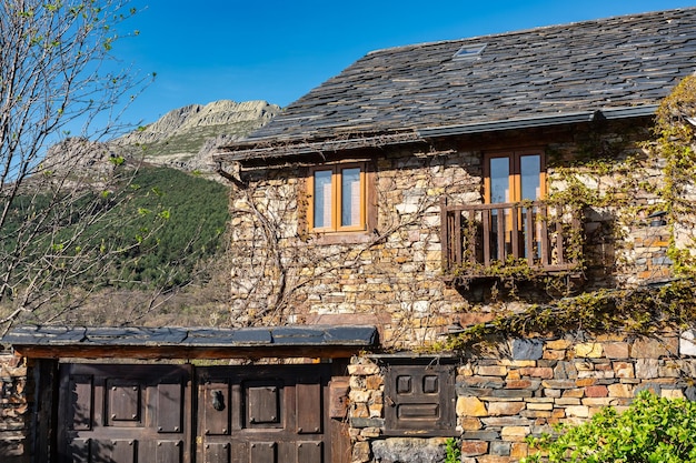 Stone houses with wooden windows and balconies in Valverde Guadalajara