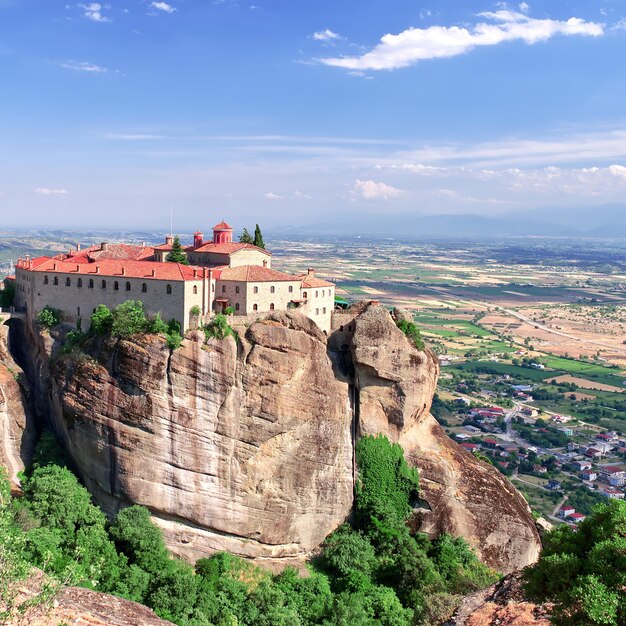 Stone monastery in the mountains Kalabaka Greece summer cloudy day in Meteora mountain valley