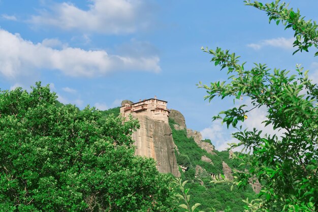 Stone monastery in the mountains Kalabaka Greece summer cloudy day in Meteora mountain valley