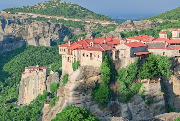 Stone monastery in the mountains Kalabaka Greece summer cloudy day in Meteora mountain valley