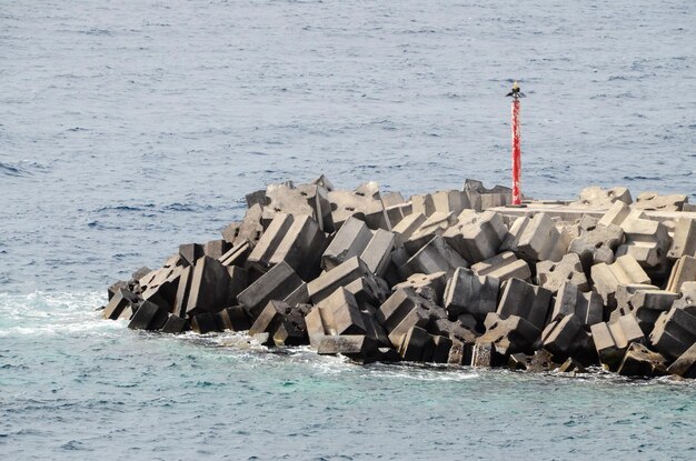 Stone Pier on the blue Atlantic Ocean Water