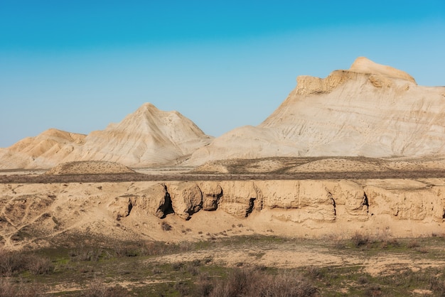 Stone rocks and green hills in a mountainous area