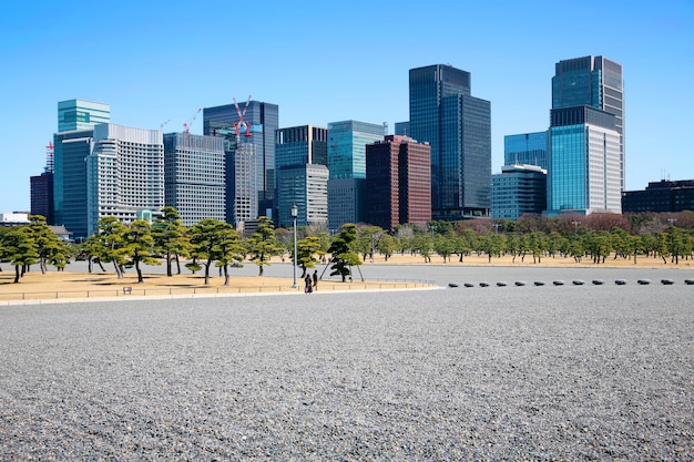 Stone square garden with modern office building in Japan