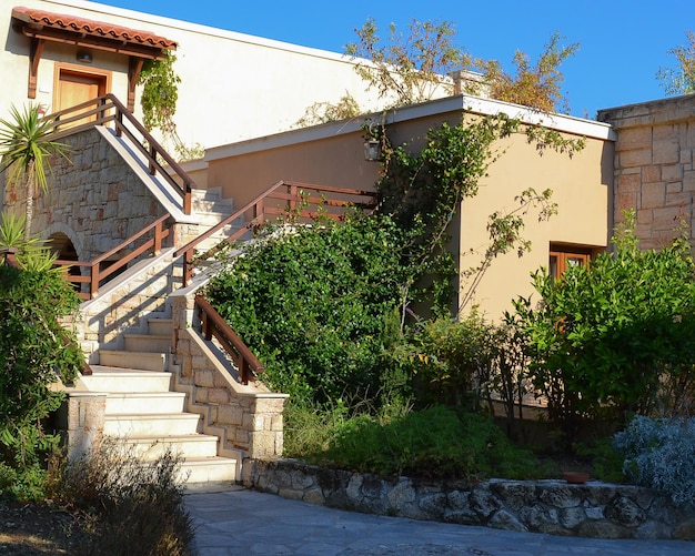 Stone stairs with railings and turns among the vegetation