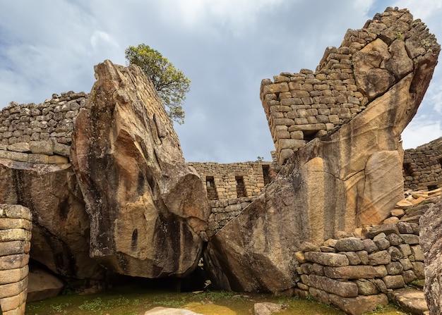 Stone symbols and Ruins of Machu Picchu the ancient Inca city in the Andes Cusco Peru