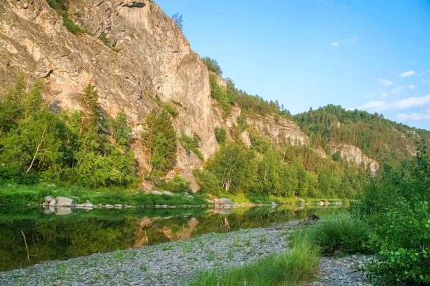 Stone top of rocks with trees and river