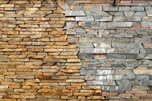 Stone wall Masonry walls made of rough stone hewn wet discord color Stone background