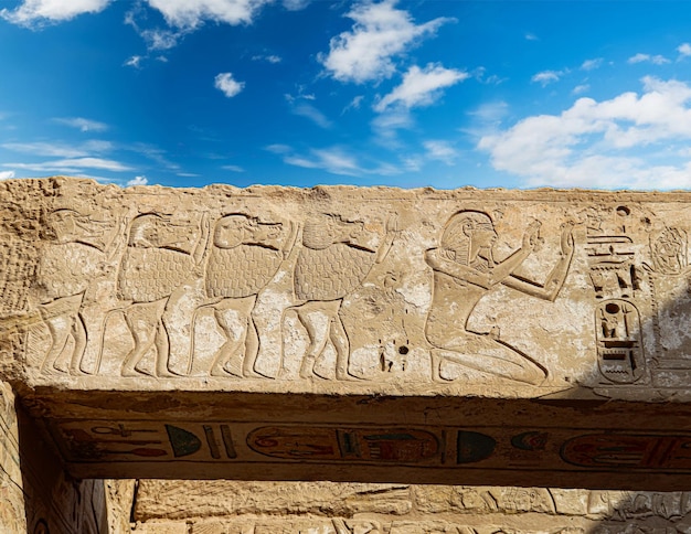 A stone wall with a man on it with a spear on it