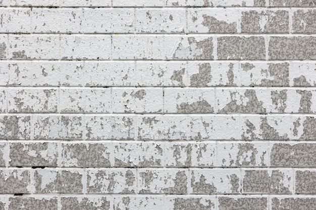 Stone wall with peeled paint