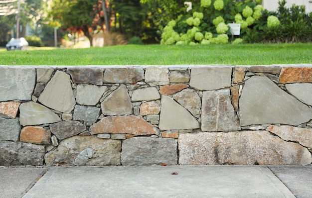 A stone wall with a small number of stones on it