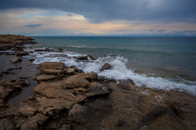 Stone in the water, Mountain lake, Issyk-Kul, Kyrgyzstan