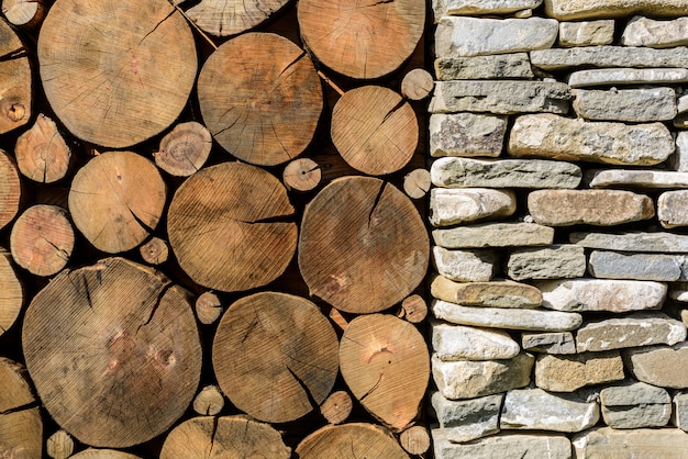 Stone and wood background. Building with stone column and wood cross section texture.