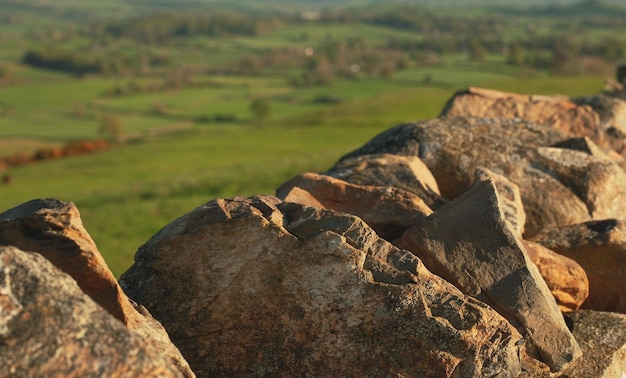 Stones on the background of green hills