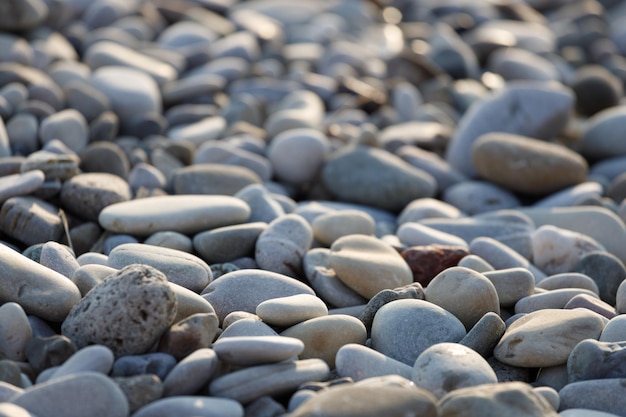 Stones lying on the pebble sea beach. High quality photo