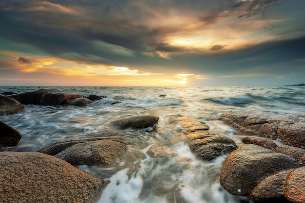 Stones in the sea at sunset