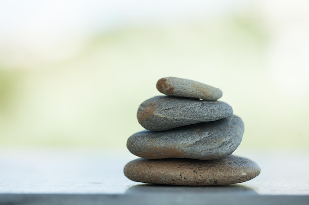 Stones on white background outdoors with sunlight