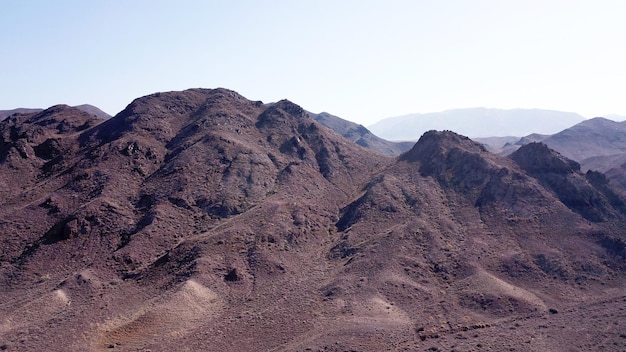 Stony hills of dark color in the steppe