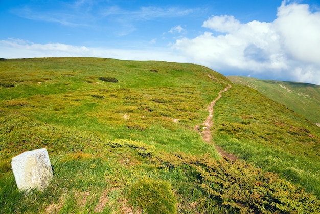 Stony post on summer mountain ridge (Ukraine, Carpathian Mountains)