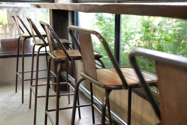 Stool in cafe coffee shop near garden window