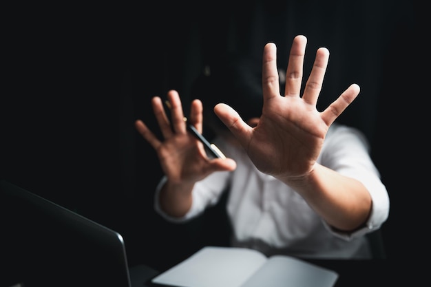 Stop harassment violence in workplace concept Boss or employer sexually harassed a business woman at work Depressed girl sitting in office stop violence against Women international women's day