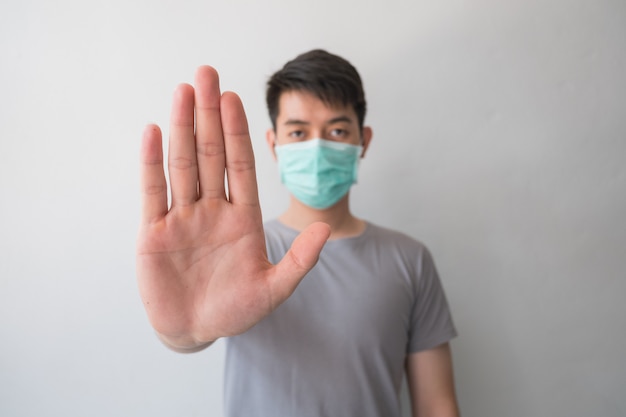 Stop the infection! Healthy man showing gesture 