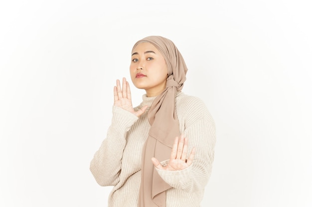 Stop or Rejection Gesture of Beautiful Asian Woman Wearing Hijab Isolated On White Background