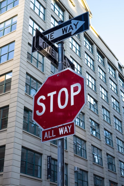 A stop sign with a one way sign on it