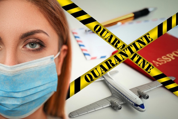 Stop travelling during coronavirus quarantine Woman with medical mask and yellow awareness ribbons