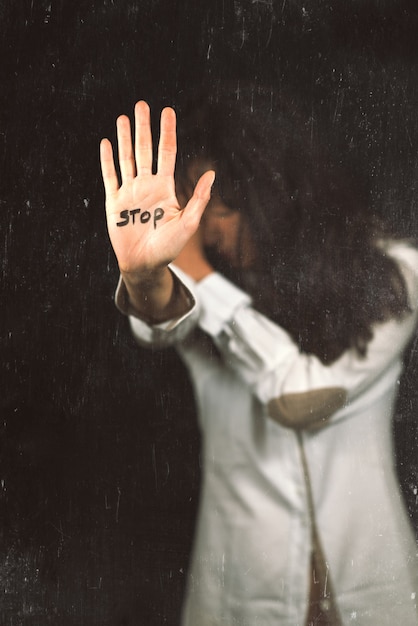 Stop violence against women. Hand saying stop.