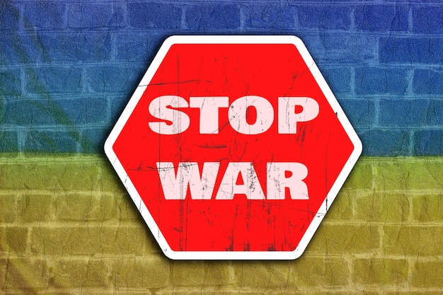 Stop war on red road sign