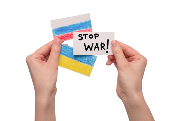 Photo stop war text on a card isolated on a white background in woman hands