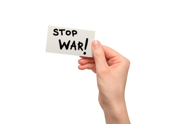 Stop war text on a card isolated on a white background in woman hands