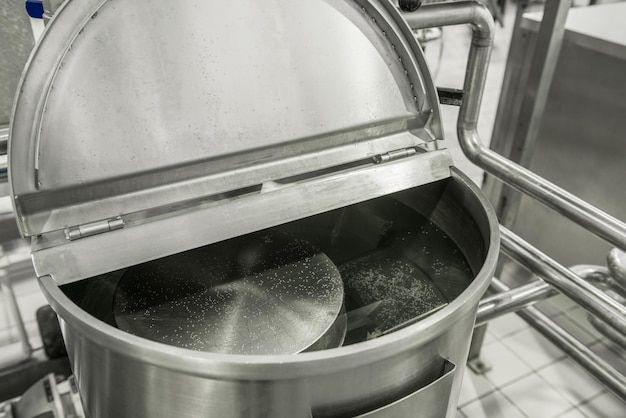 Storage and pasteurization tank at the milk factory equipment at the dairy plant