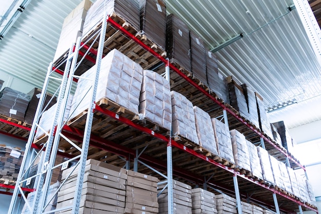 Storage warehouse and racks on which there are cardboard boxes with finished products