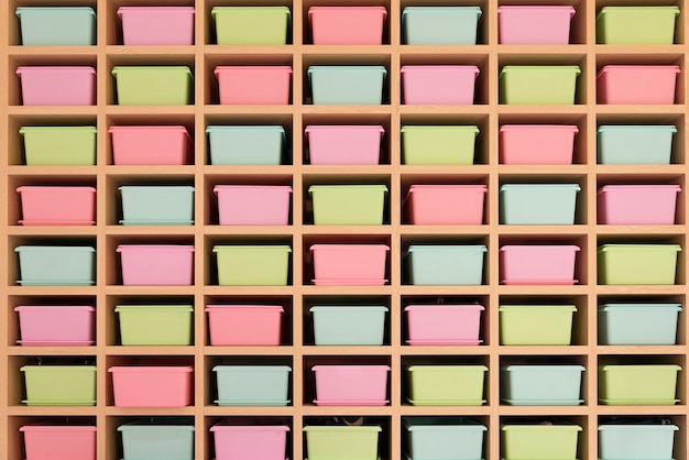 Storage with pink, blue and yellow boxes