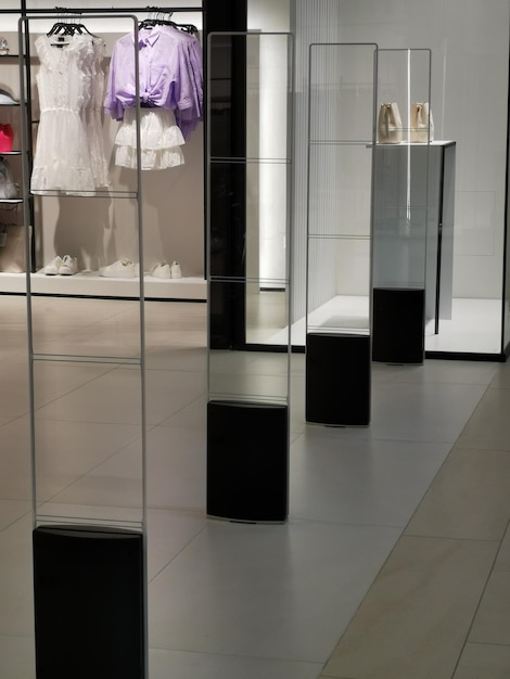 A store with a display of shoes and a dress on display.