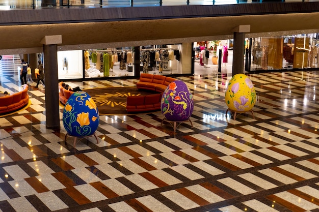 A store with a storefront that has a large number of eggs on it.