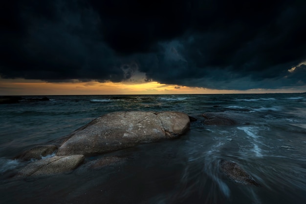 Storm before sunset in the sea