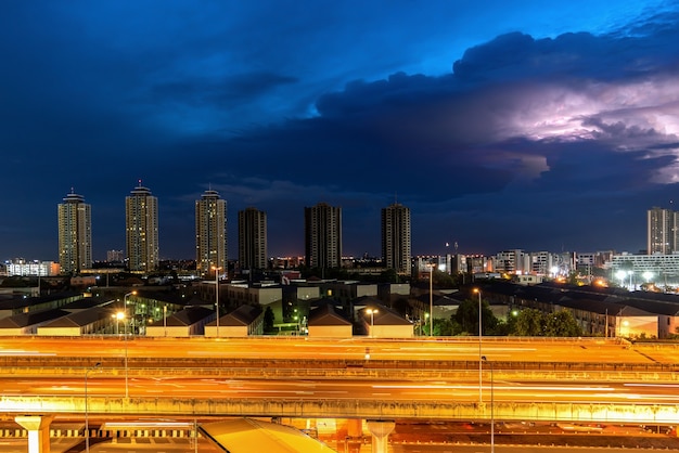 Storm in a city in purple light at night