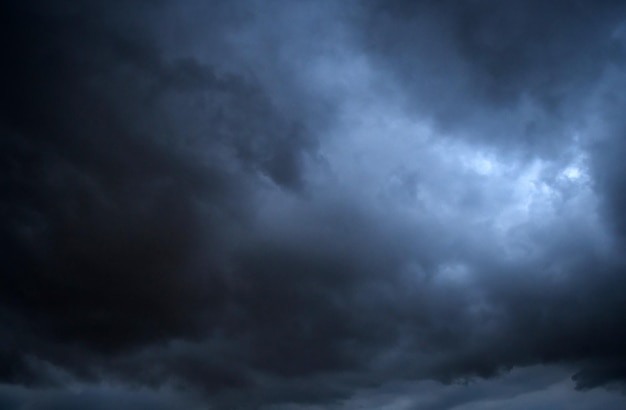 Storm clouds floating in a rainy day with natural light Cloudscape scenery overcast weather above blue sky White and grey clouds scenic nature environment background