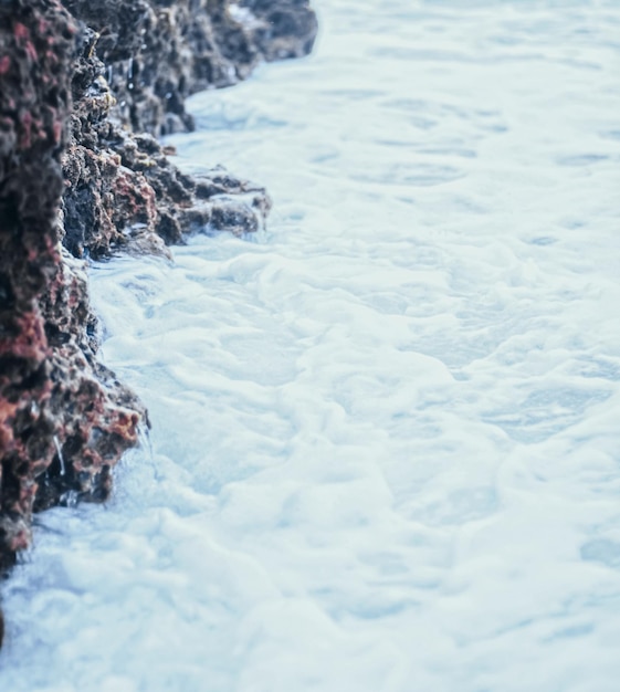 Storm in the ocean sea waves crashing on rocks on the beach coast nature and waterscape