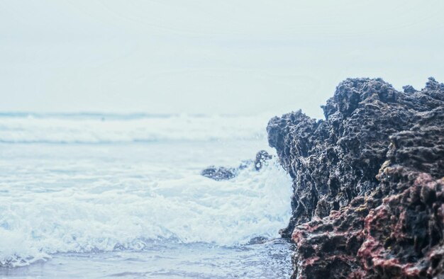 Storm in the ocean sea waves crashing on rocks on the beach coast nature and waterscape