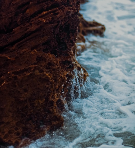 Storm in the ocean sea waves crashing on rocks on the beach coast nature and waterscape