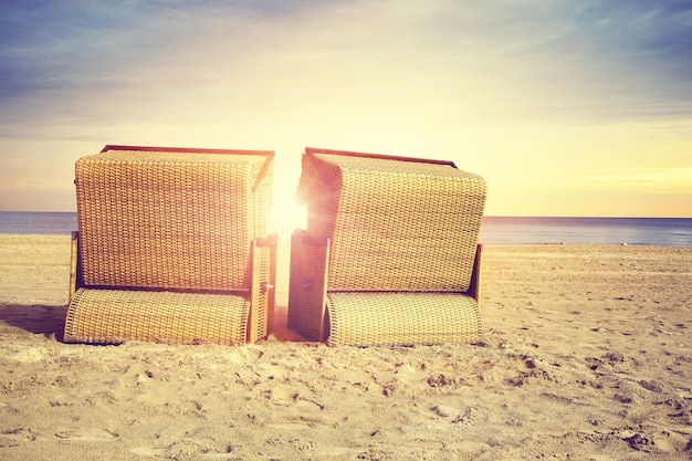 Stormy baltic sea with beach chairs and coastal dunes